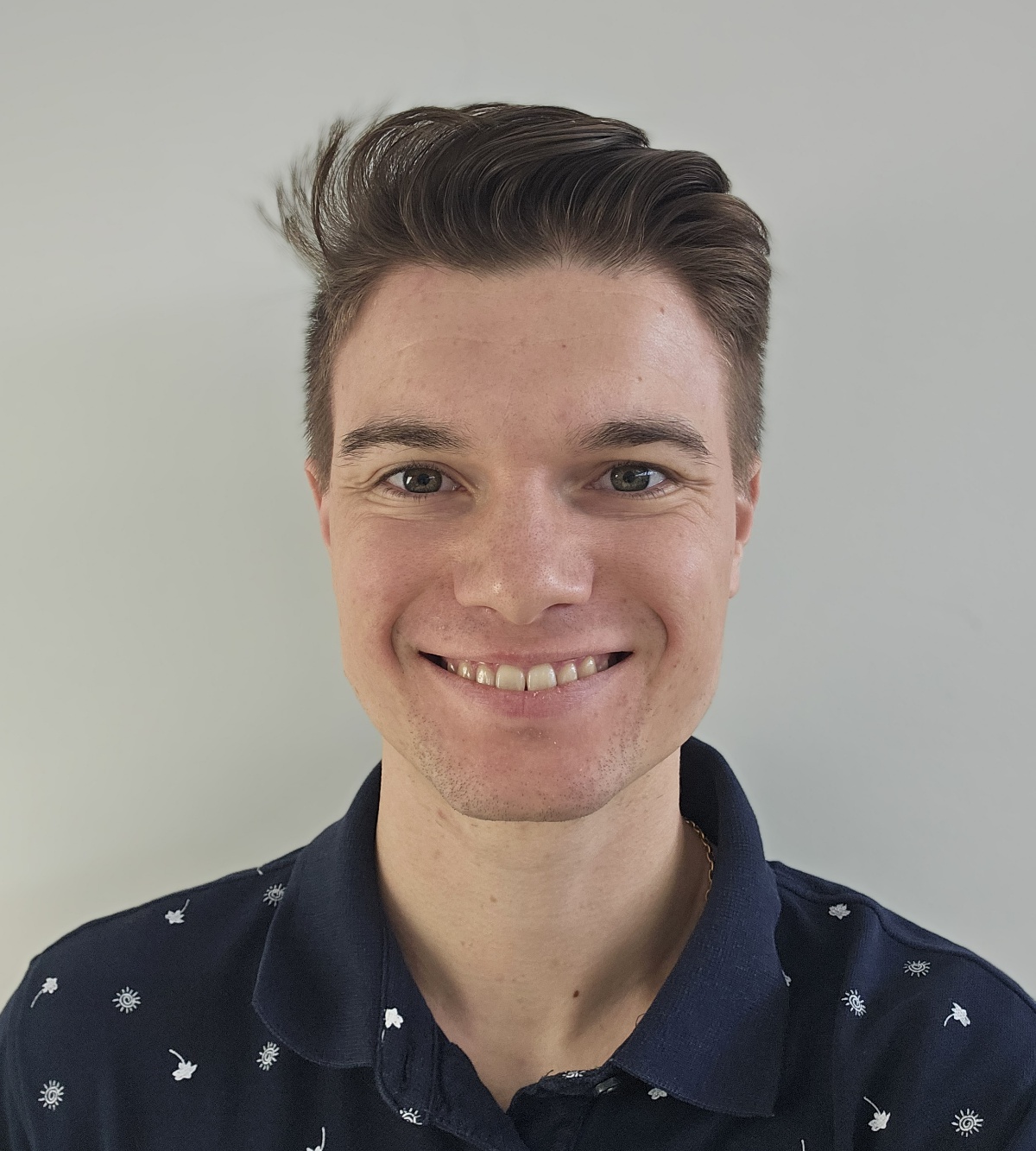 Young man with stylish hair and shirt.